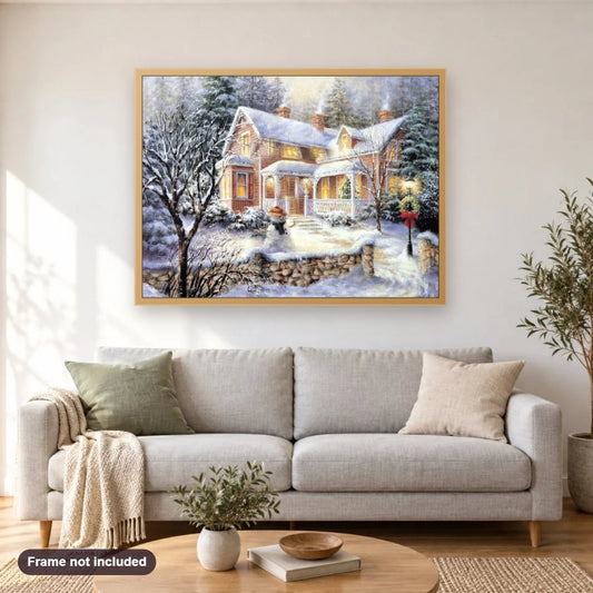 House Under Snow diamond painting shown framed on a living room wall above a sofa