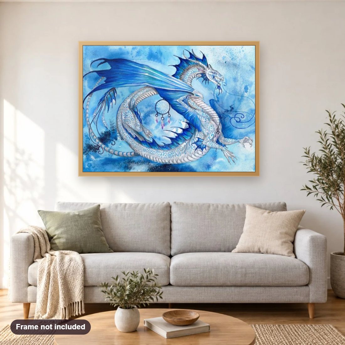 Ice Dragon diamond painting shown framed on a living room wall above a sofa