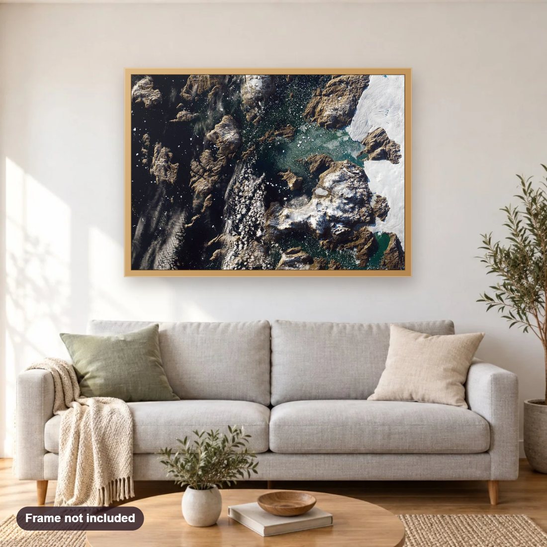 Iceberg Towers Over Greenland Village diamond painting shown framed on a living room wall above a sofa