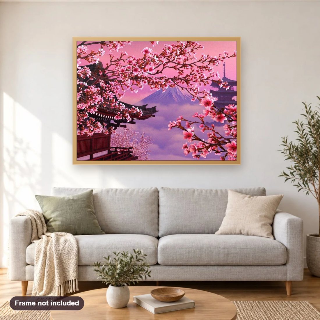 Japanese Cherry Blossoms diamond painting shown framed on a living room wall above a sofa