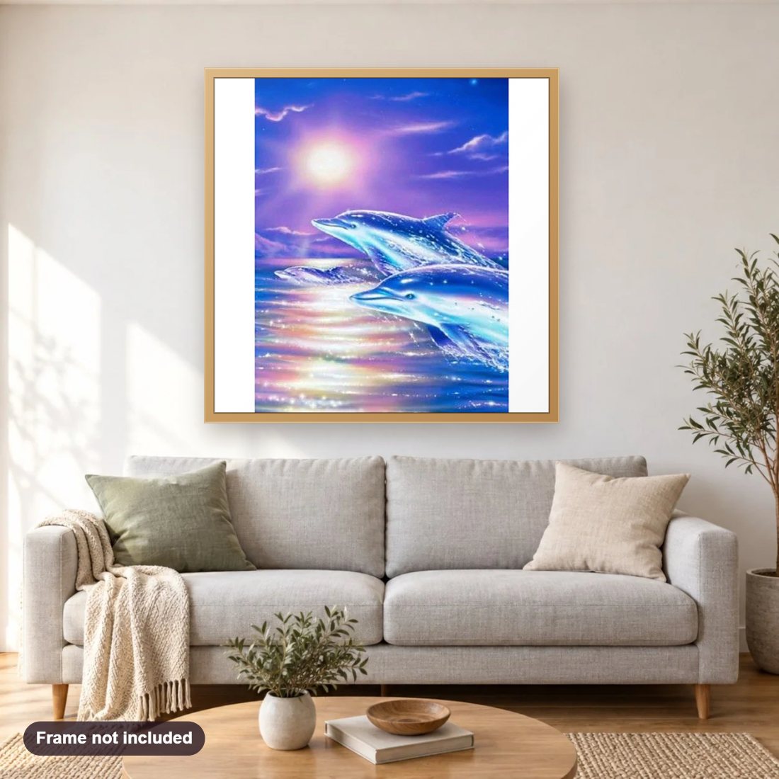 Jumping Dolphins diamond painting shown framed on a living room wall above a sofa