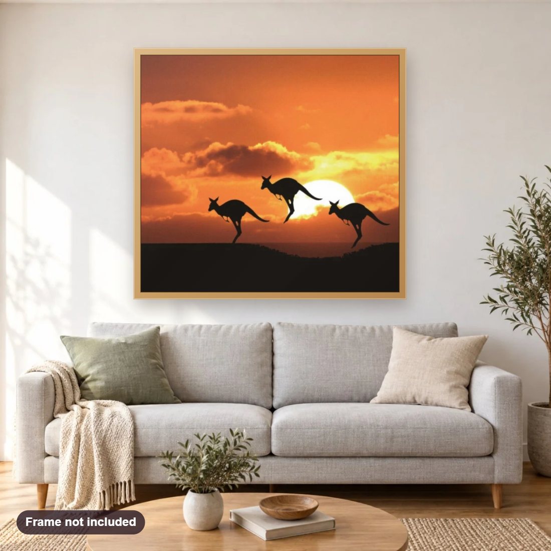 Kangaroos & Sunset diamond painting shown framed on a living room wall above a sofa