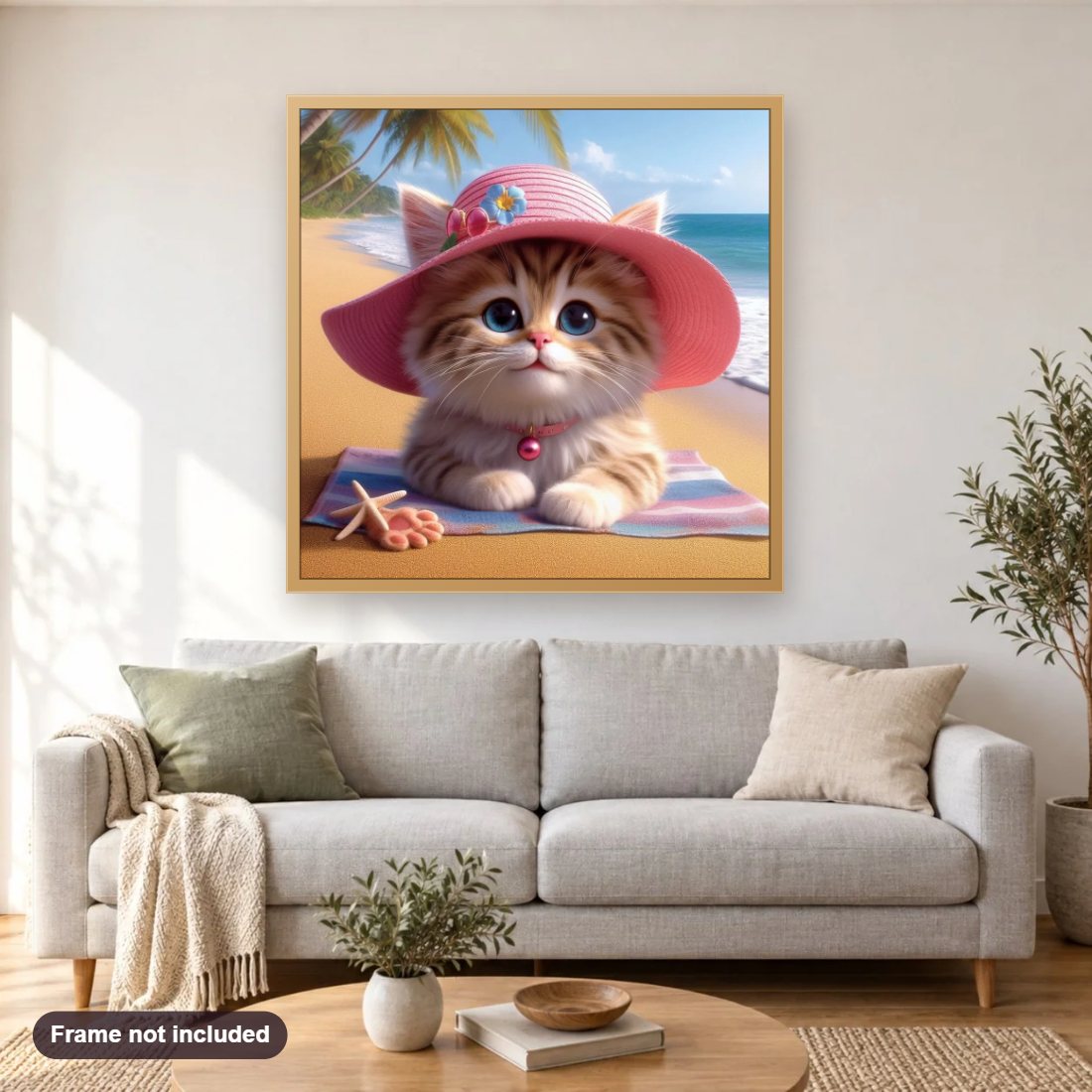 Kitten On The Beach diamond painting shown framed on a living room wall above a sofa
