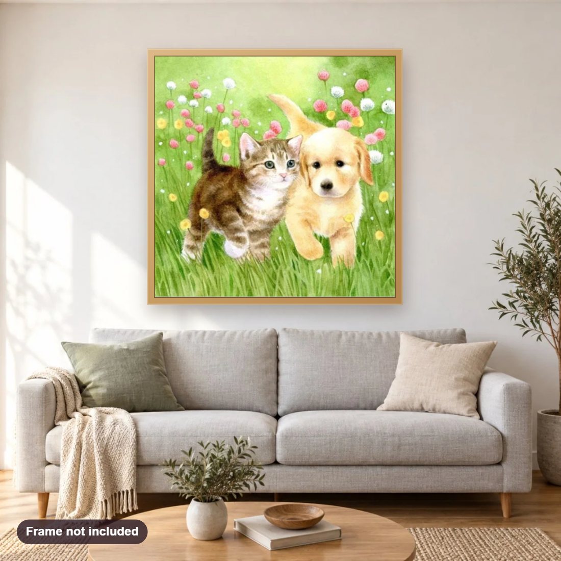 Kitten & Puppy in Garden diamond painting shown framed on a living room wall above a sofa