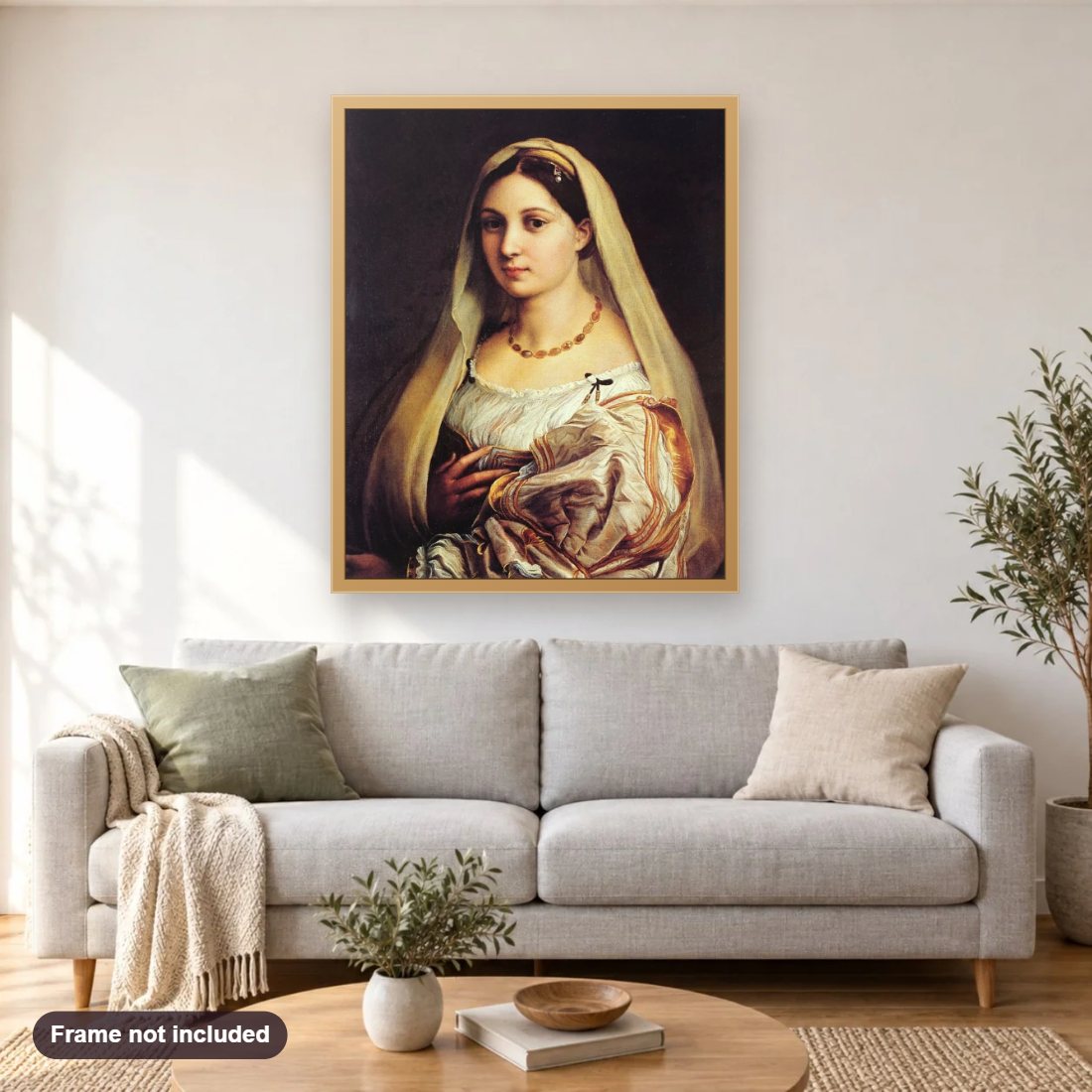 La Donna Velata diamond painting shown framed on a living room wall above a sofa
