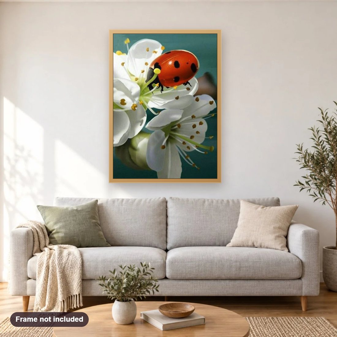 Lady Bug & White Flowers diamond painting shown framed on a living room wall above a sofa