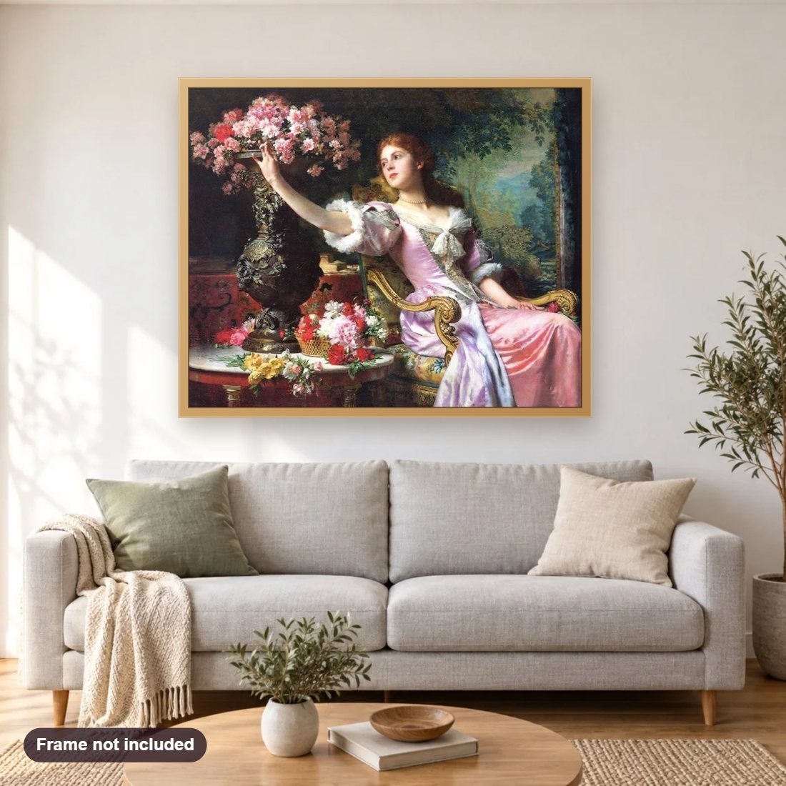 Lady in Pink Dress with Flowers diamond painting shown framed on a living room wall above a sofa
