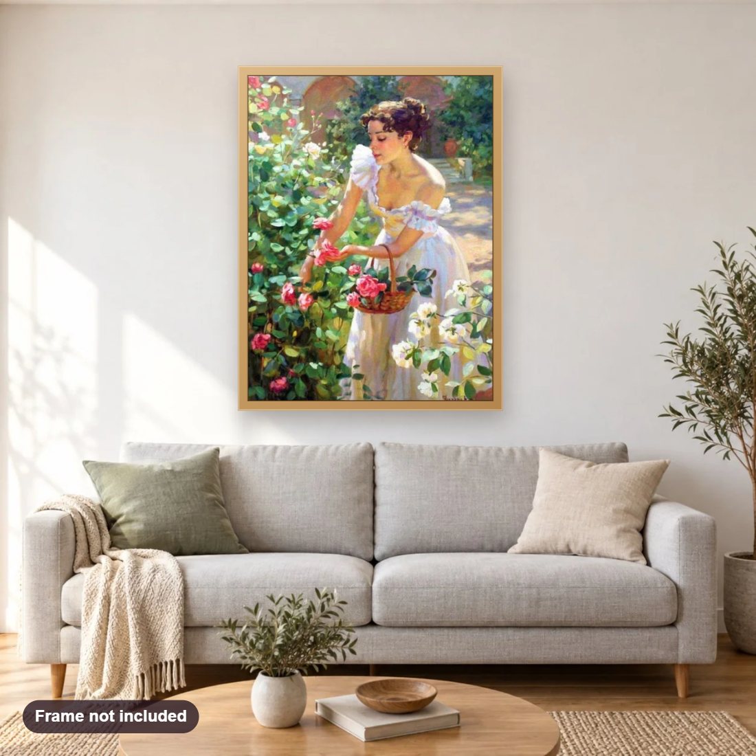 Lady Picking Roses diamond painting shown framed on a living room wall above a sofa