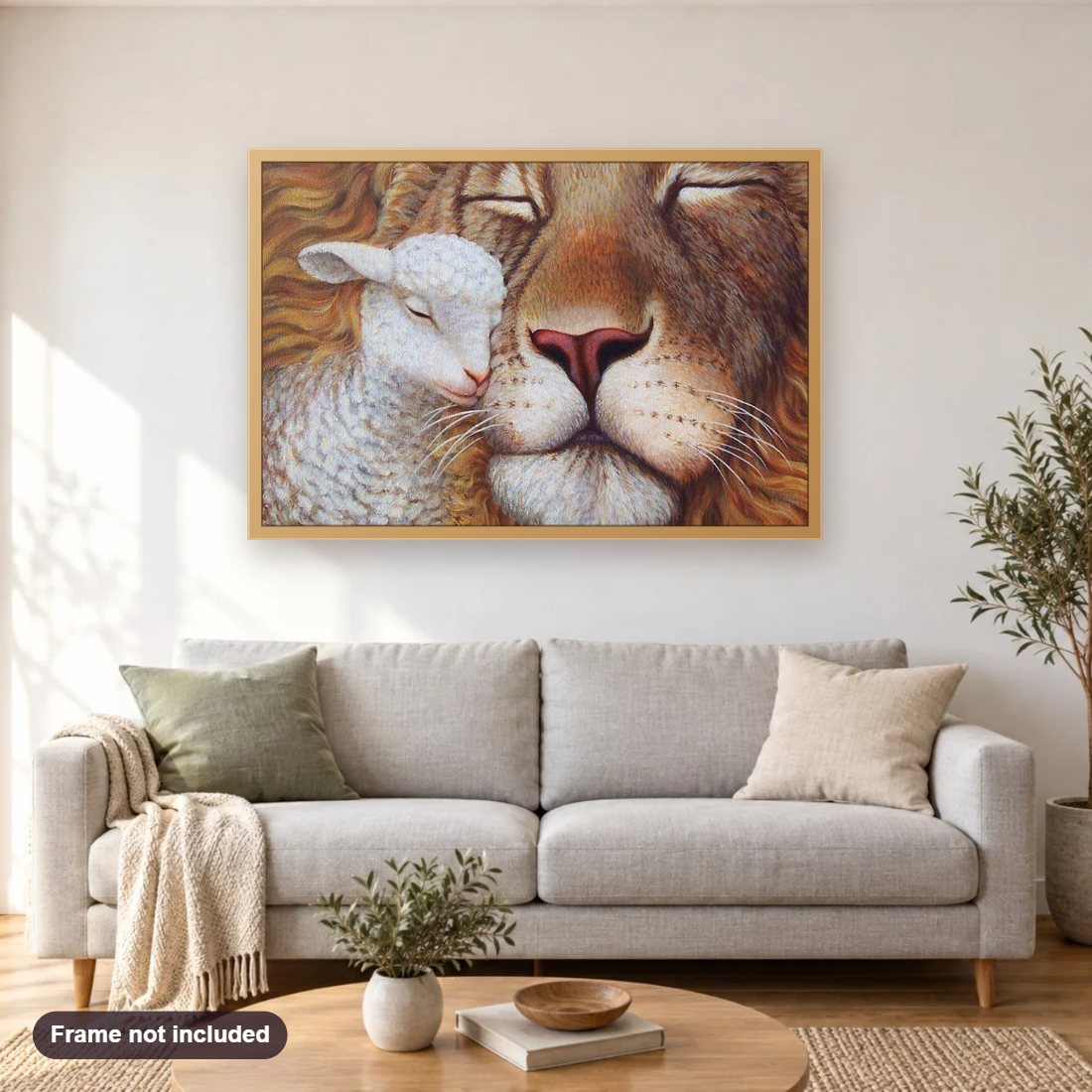 Lamb & Lion diamond painting shown framed on a living room wall above a sofa