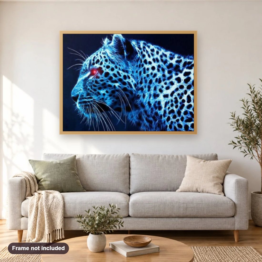 Leopard with Red Eyes diamond painting shown framed on a living room wall above a sofa
