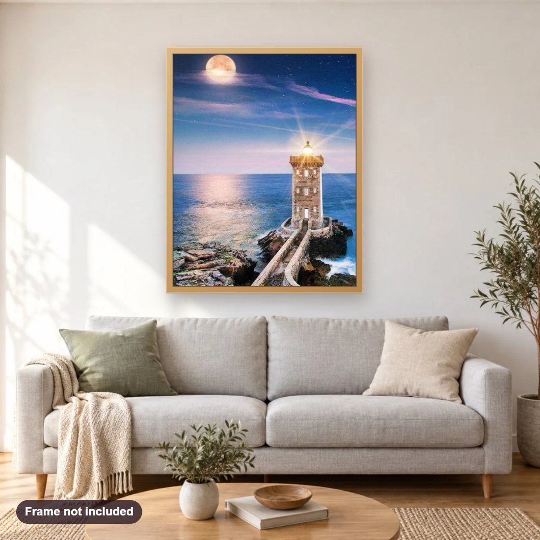 Light House diamond painting shown framed on a living room wall above a sofa