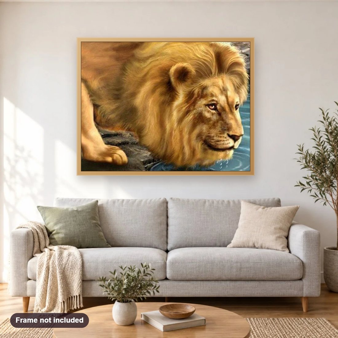 Lion Drinking Water diamond painting shown framed on a living room wall above a sofa