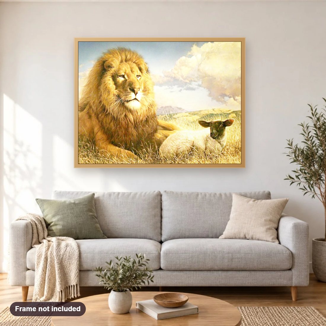 Lion & Lamb Sitting Together diamond painting shown framed on a living room wall above a sofa