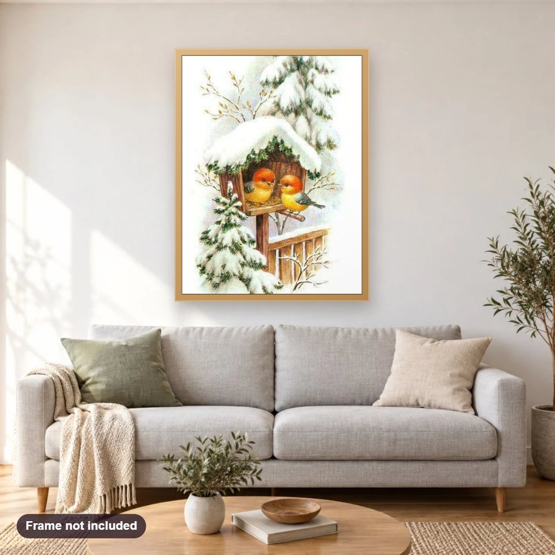 Little Birds House in Snow diamond painting shown framed on a living room wall above a sofa