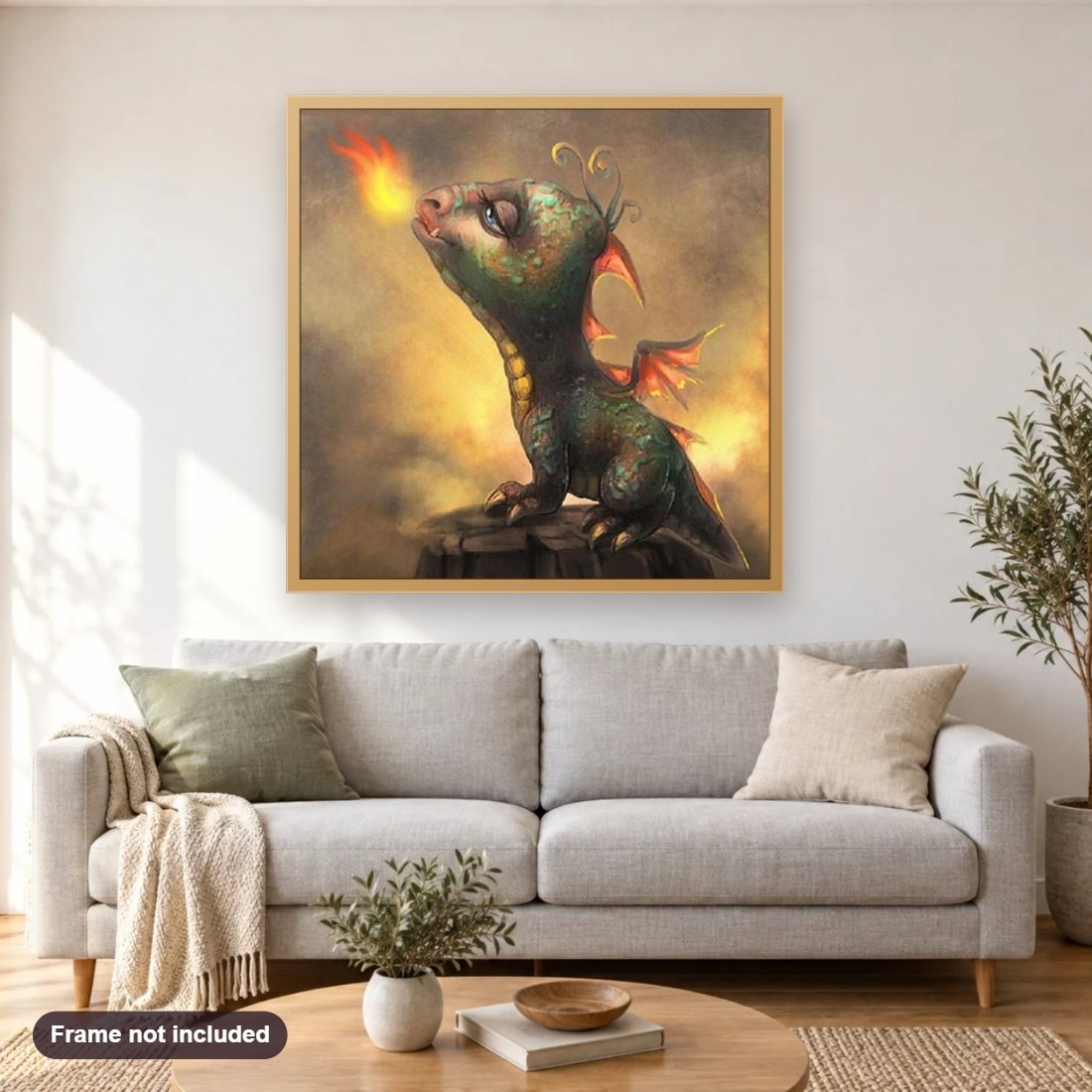 Little Dragon Blowing Fire diamond painting shown framed on a living room wall above a sofa