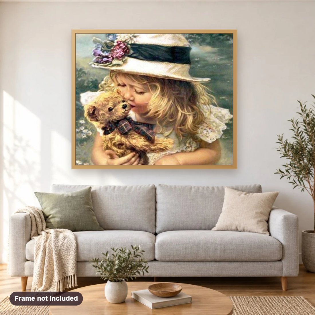Little Girl with Teddy Bear diamond painting shown framed on a living room wall above a sofa