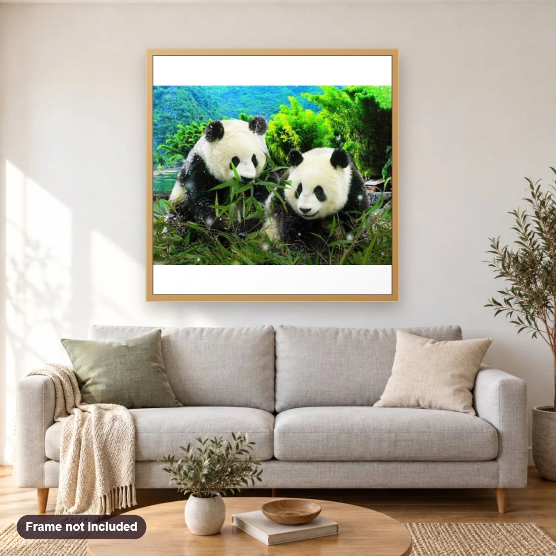 Little Panda Friend's diamond painting shown framed on a living room wall above a sofa