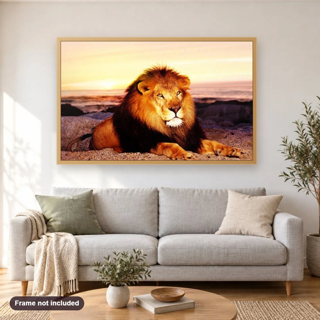 Lonely Lion in the Mountains diamond painting shown framed on a living room wall above a sofa
