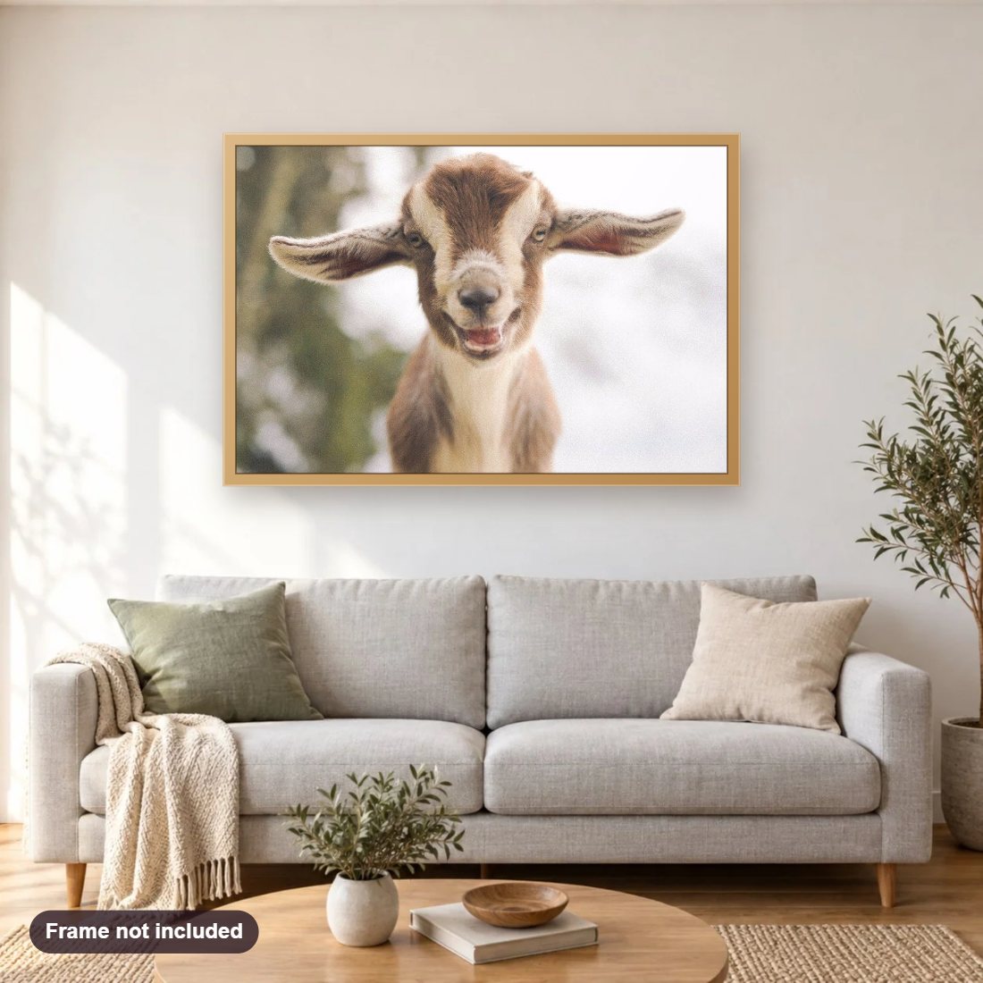 Lovely Little Goat diamond painting shown framed on a living room wall above a sofa