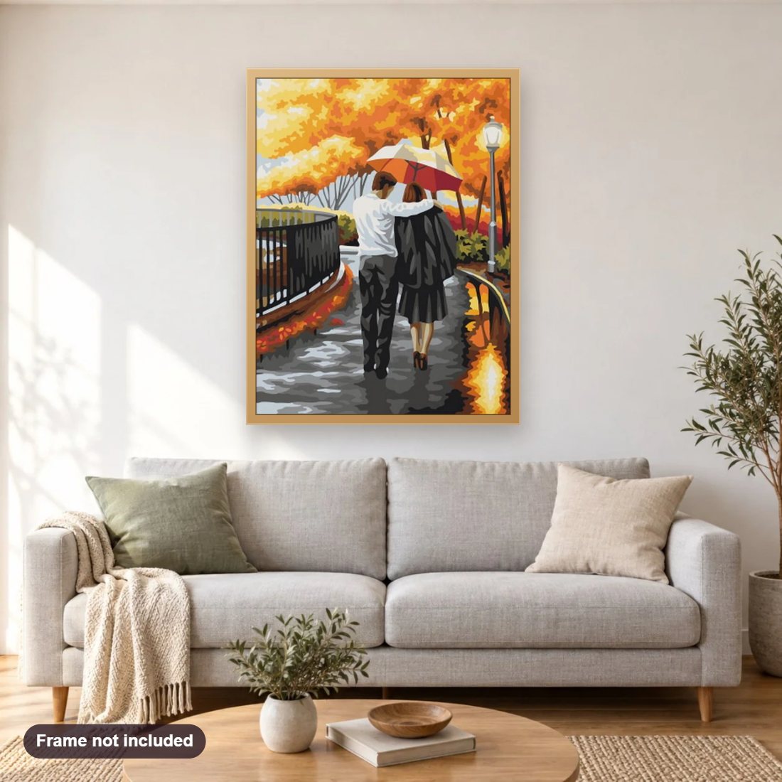 Loving Couple Walking with Umbrella diamond painting shown framed on a living room wall above a sofa