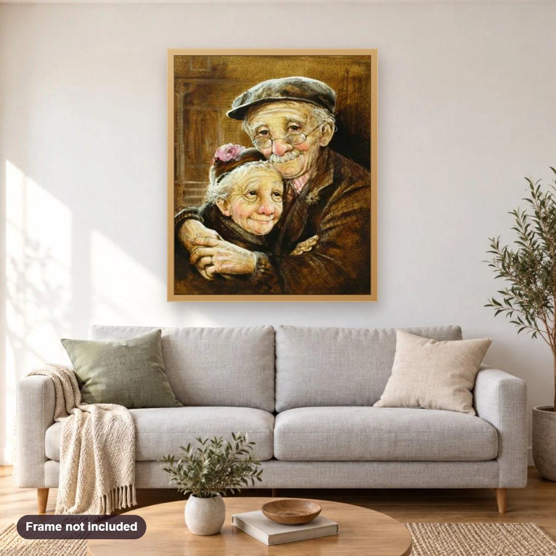 Loving Old Couple diamond painting shown framed on a living room wall above a sofa