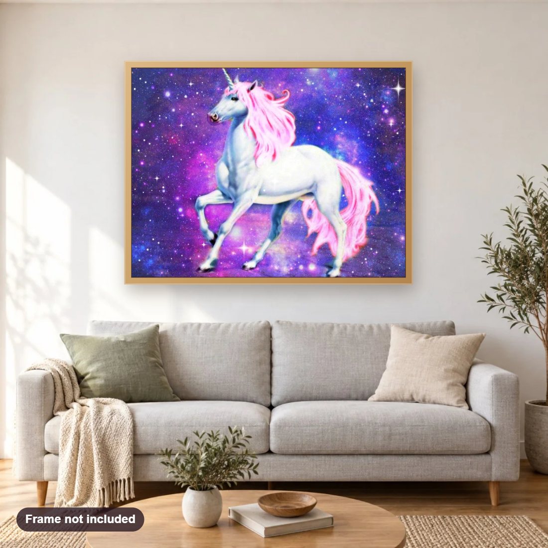 Magical Unicorn in Galaxy diamond painting shown framed on a living room wall above a sofa