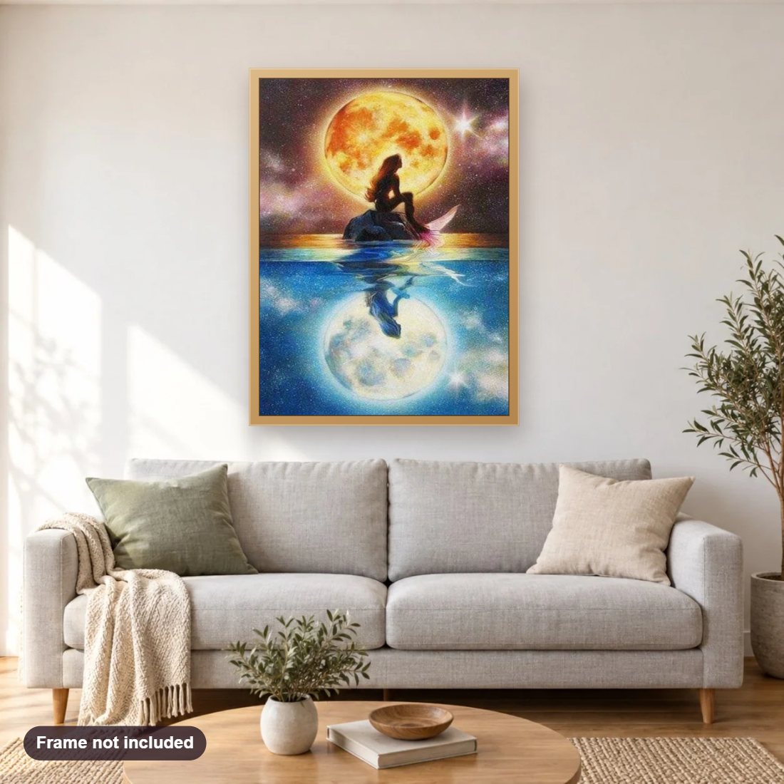Mermaid & Full Moon diamond painting shown framed on a living room wall above a sofa