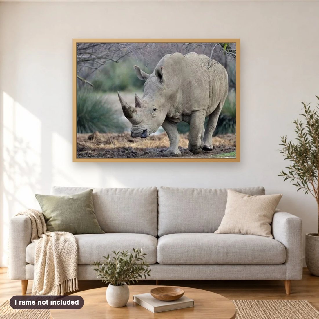 Mighty Rhino diamond painting shown framed on a living room wall above a sofa