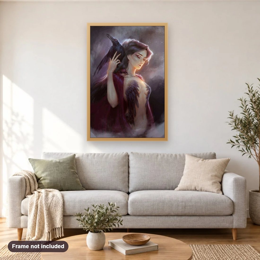 Morrigan Raven Goddess diamond painting shown framed on a living room wall above a sofa