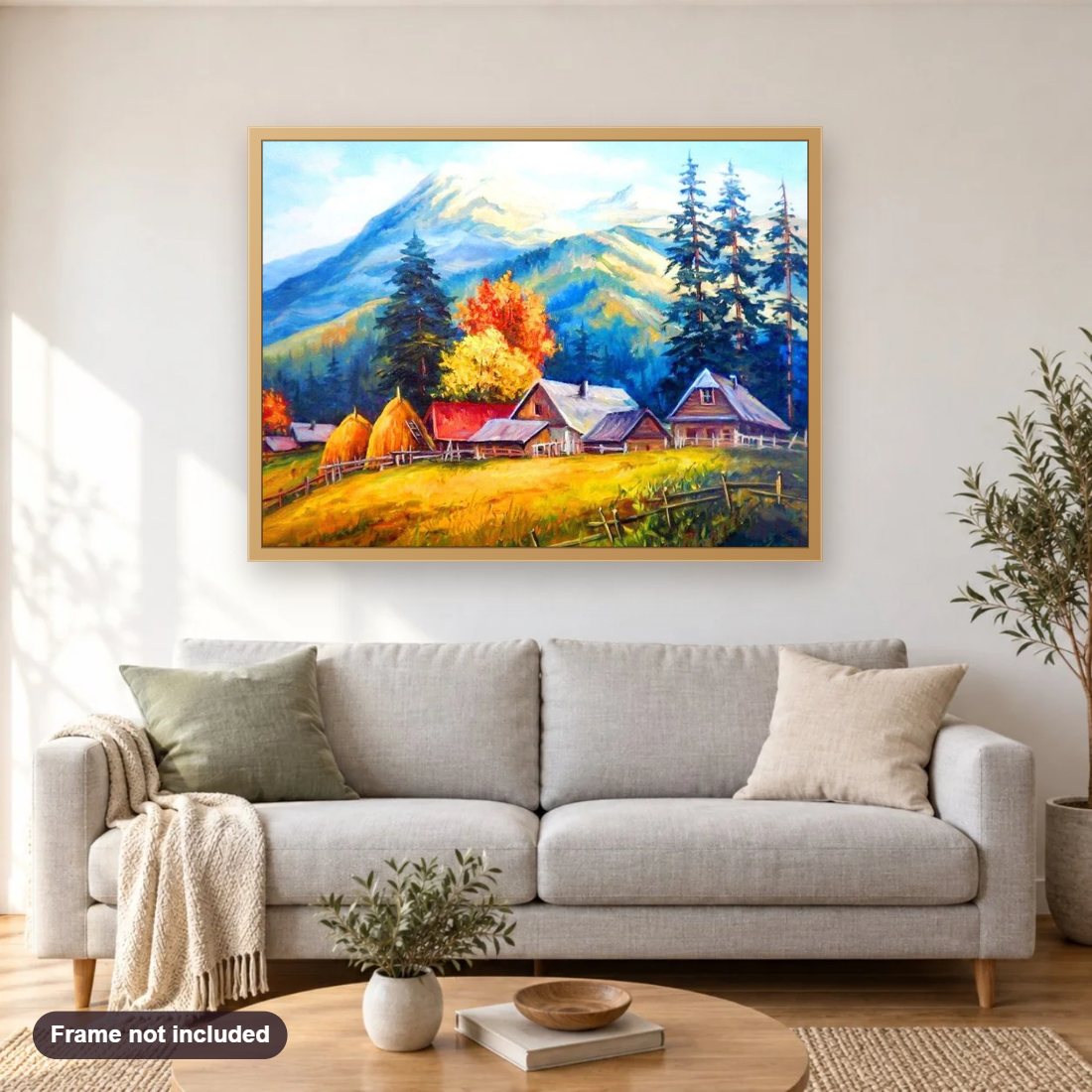 Mountains & Houses diamond painting shown framed on a living room wall above a sofa