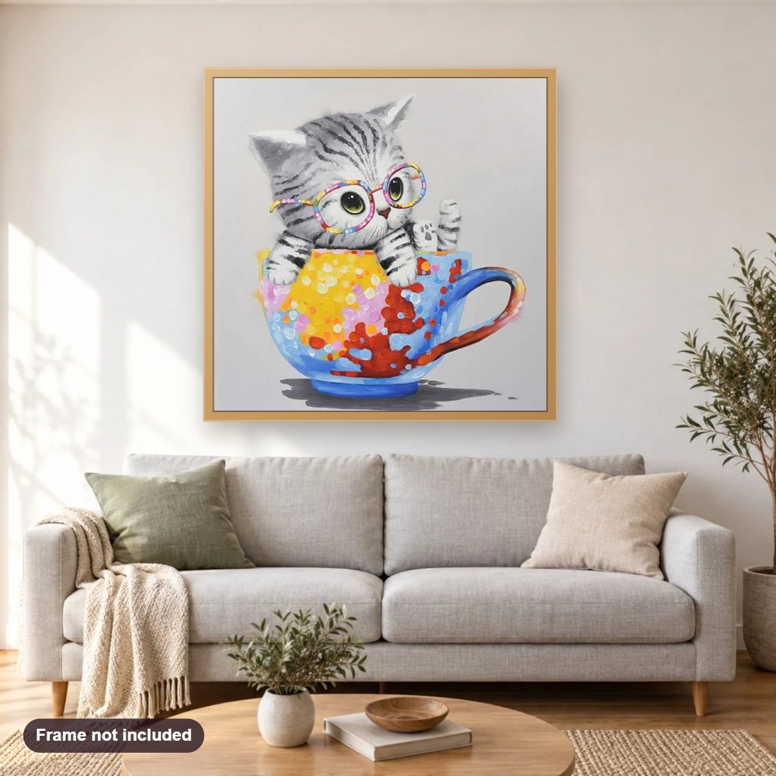 Mug Kitty diamond painting shown framed on a living room wall above a sofa