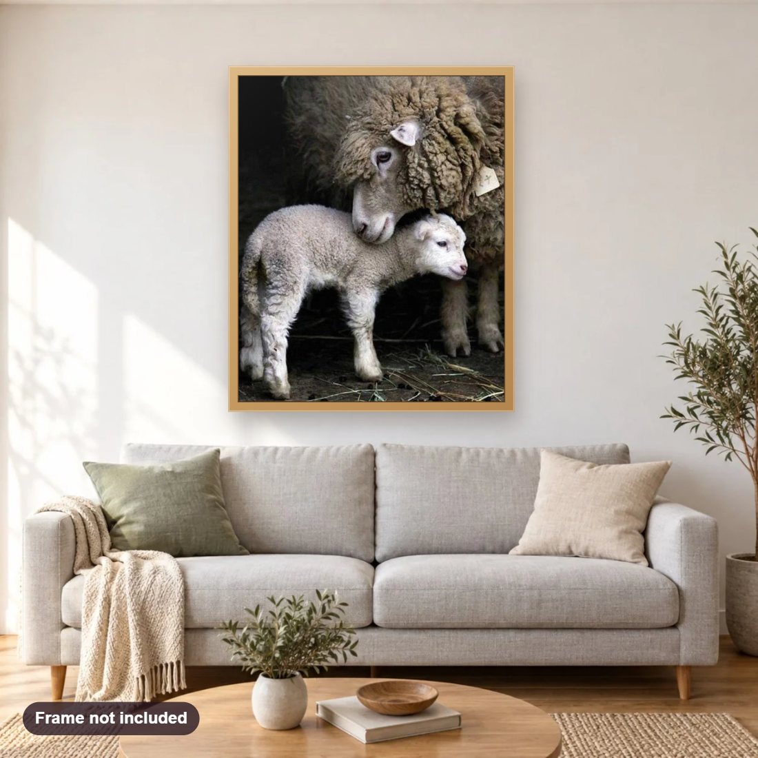 Mummy & Baby Sheep diamond painting shown framed on a living room wall above a sofa