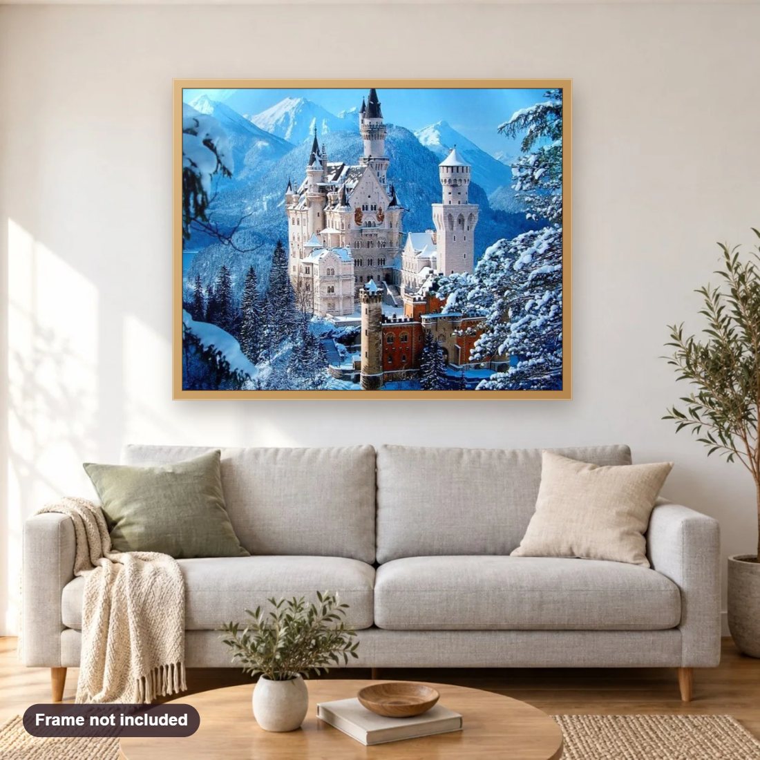 Neuschwanstein Castle in Winter diamond painting shown framed on a living room wall above a sofa