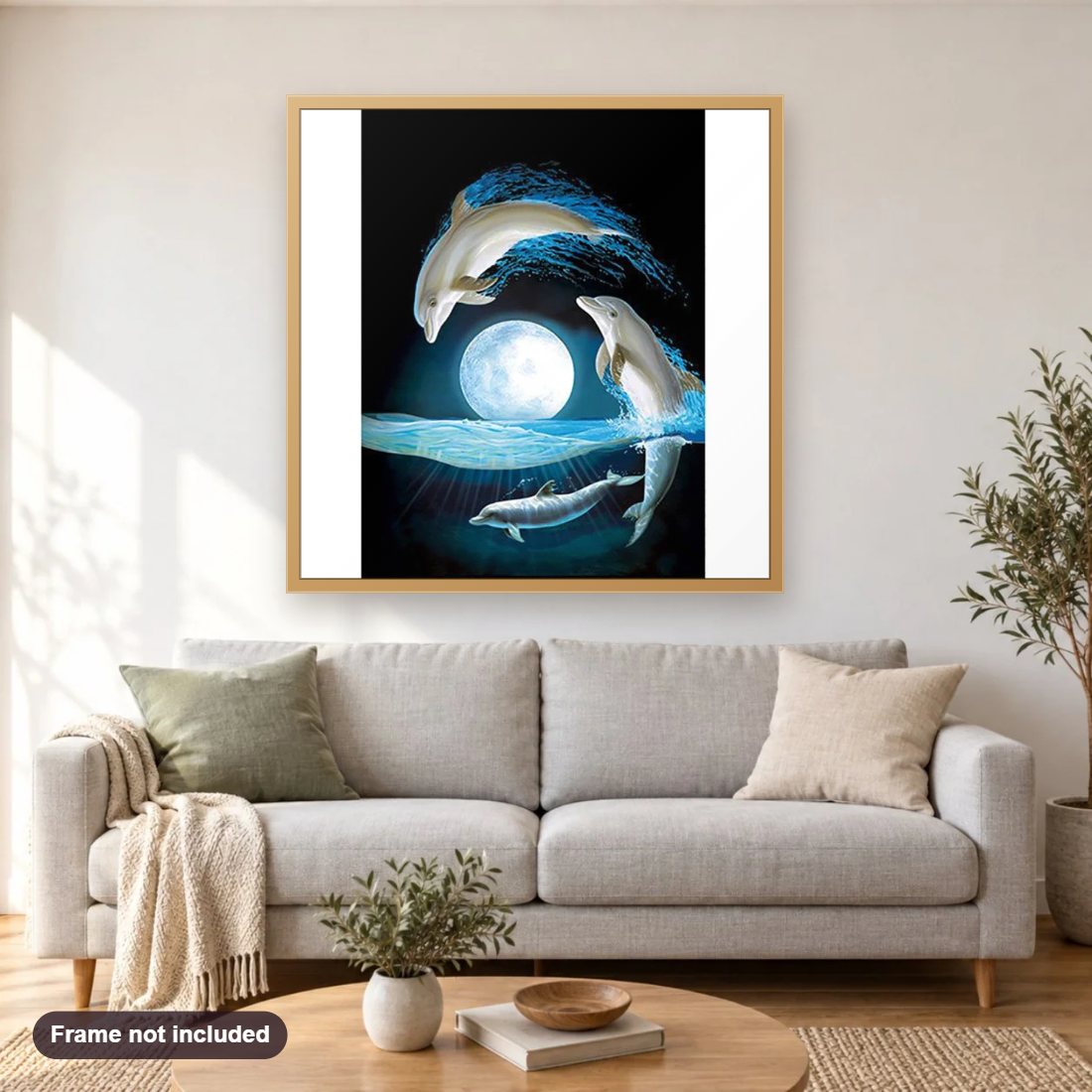 Night Dolphins diamond painting shown framed on a living room wall above a sofa