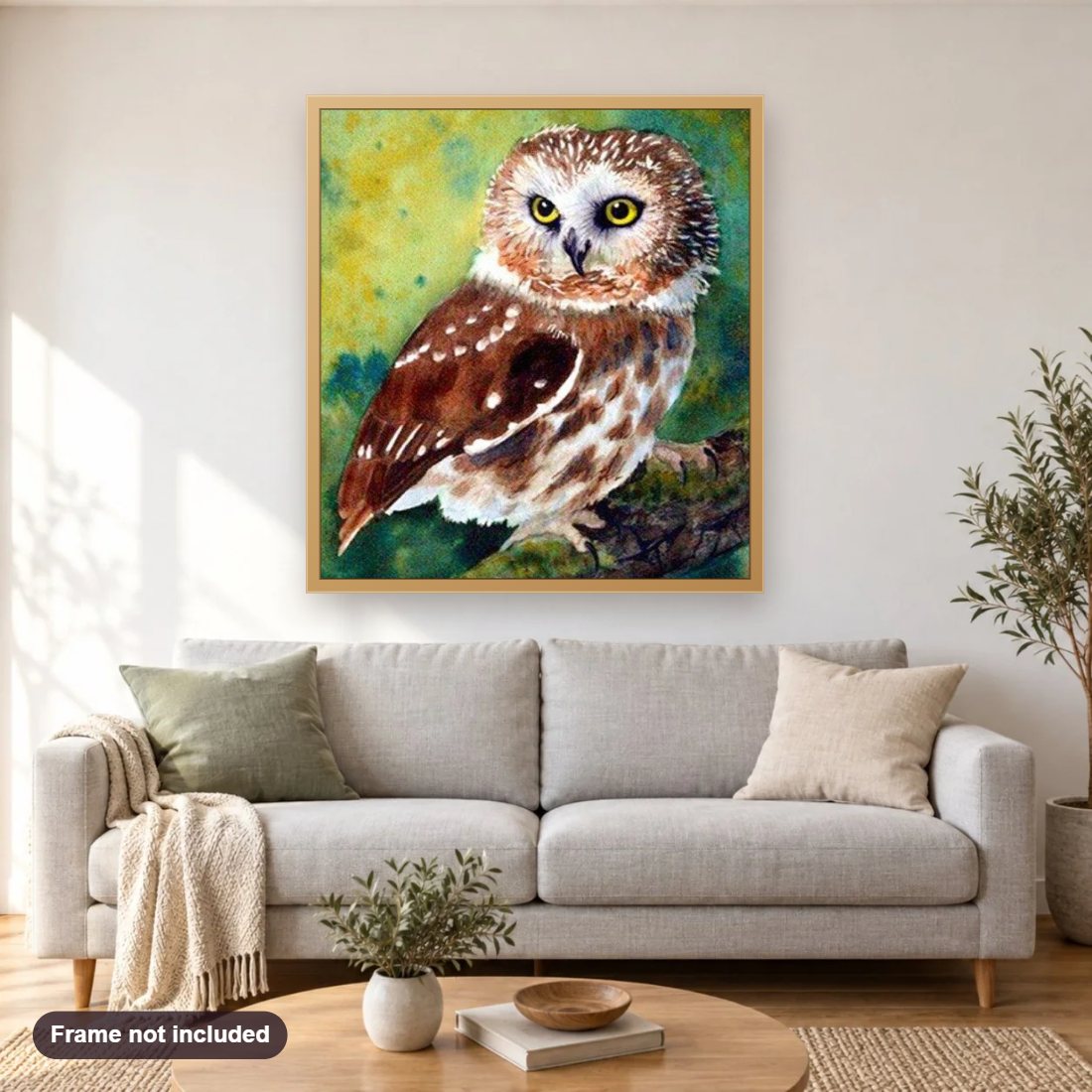 Northern Saw Whet Owl diamond painting shown framed on a living room wall above a sofa