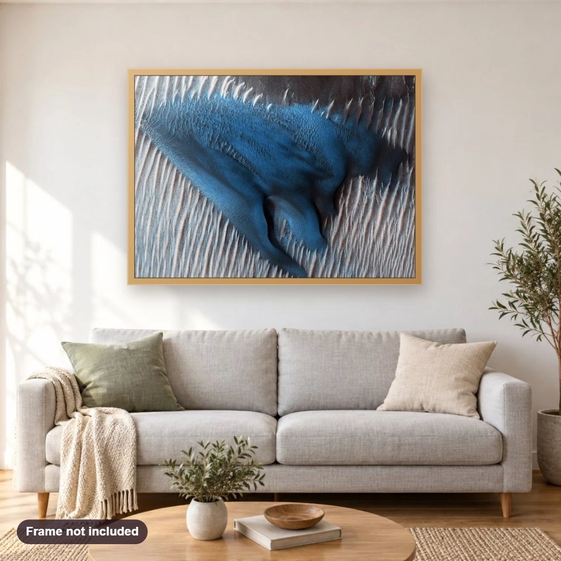 Once in a Blue Dune diamond painting shown framed on a living room wall above a sofa