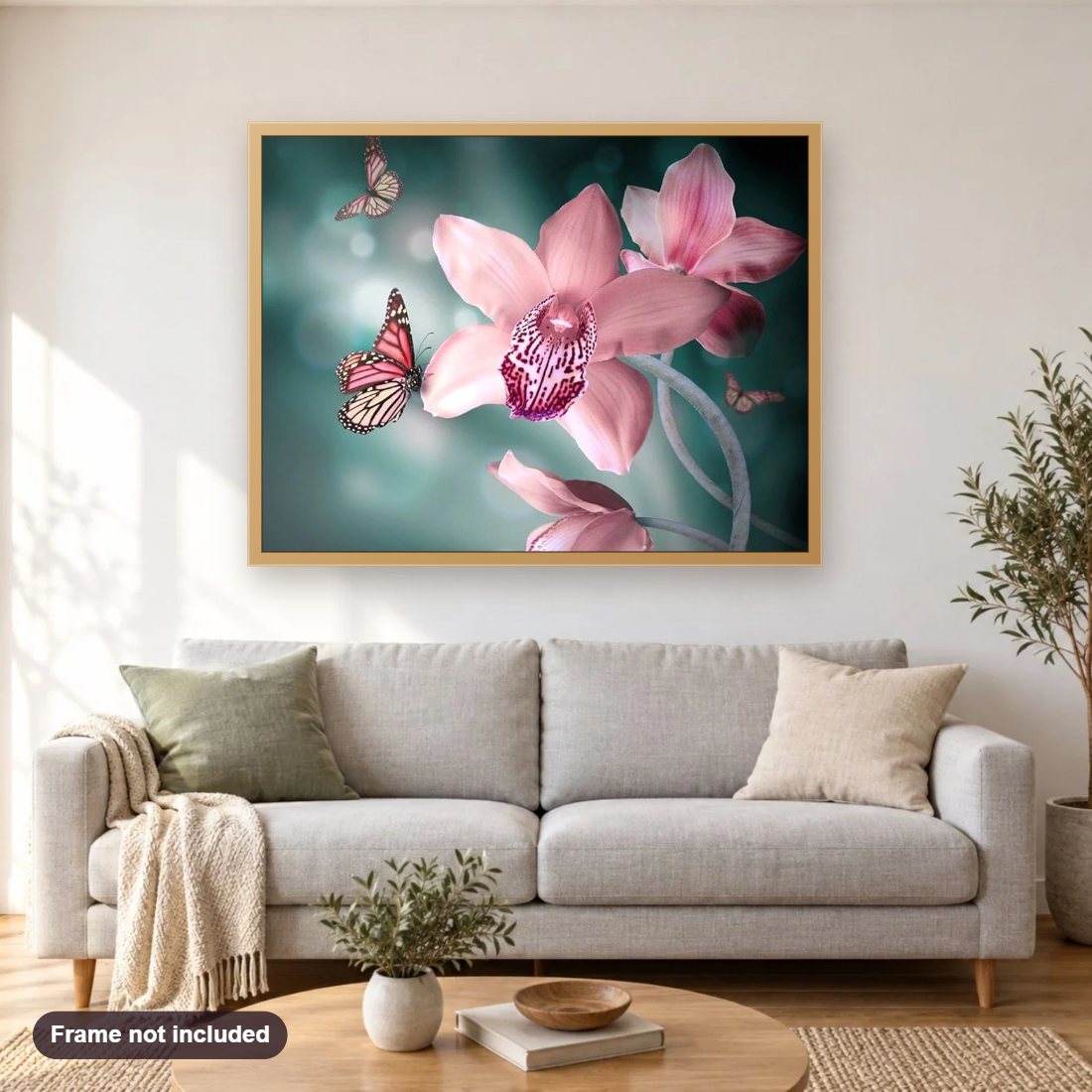Orchids & Butterflies diamond painting shown framed on a living room wall above a sofa