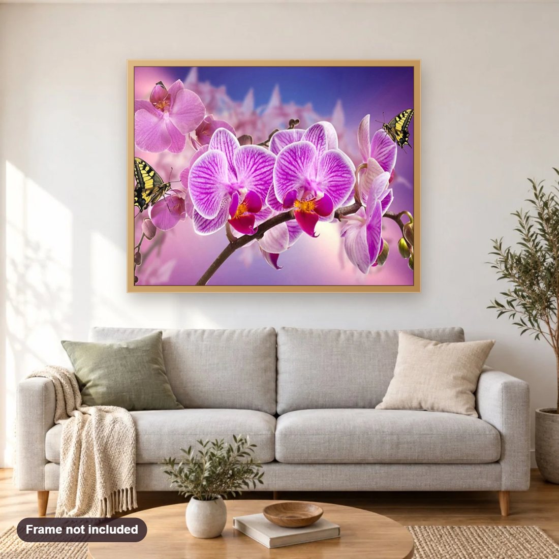 Orchids & Butterflies diamond painting shown framed on a living room wall above a sofa