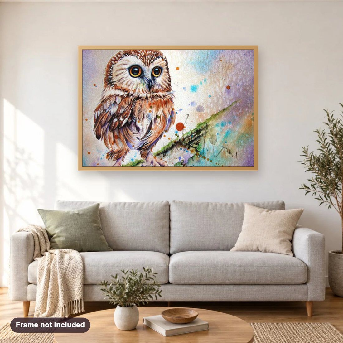 Owl diamond painting shown framed on a living room wall above a sofa