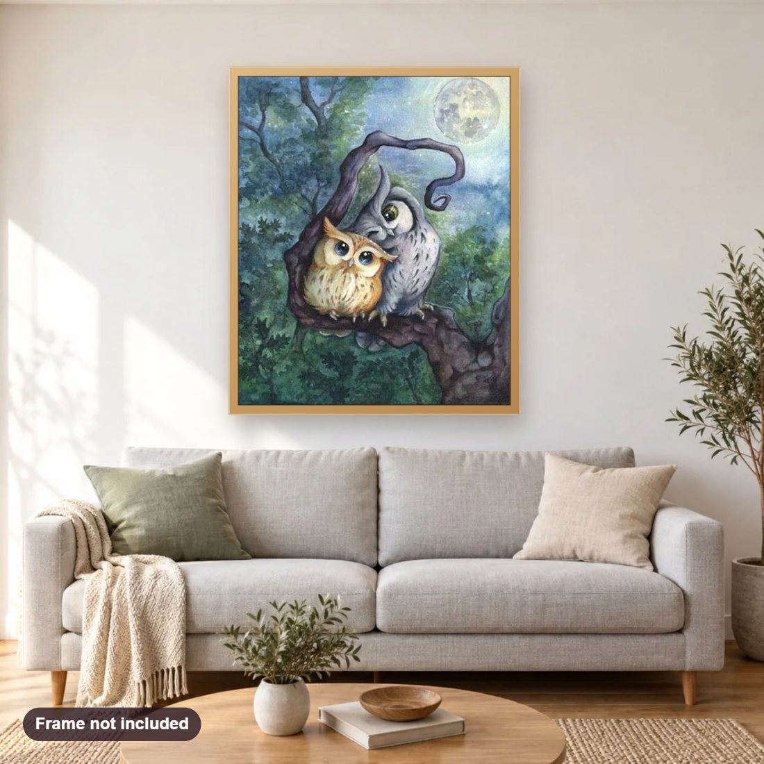 Owls in Love diamond painting shown framed on a living room wall above a sofa