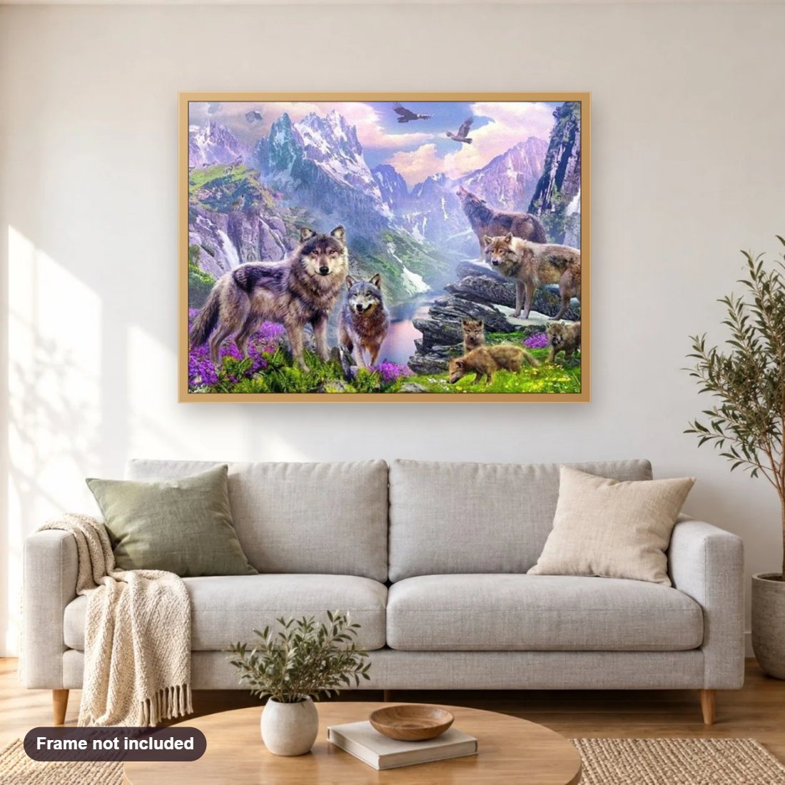 Pack of Wolves diamond painting shown framed on a living room wall above a sofa