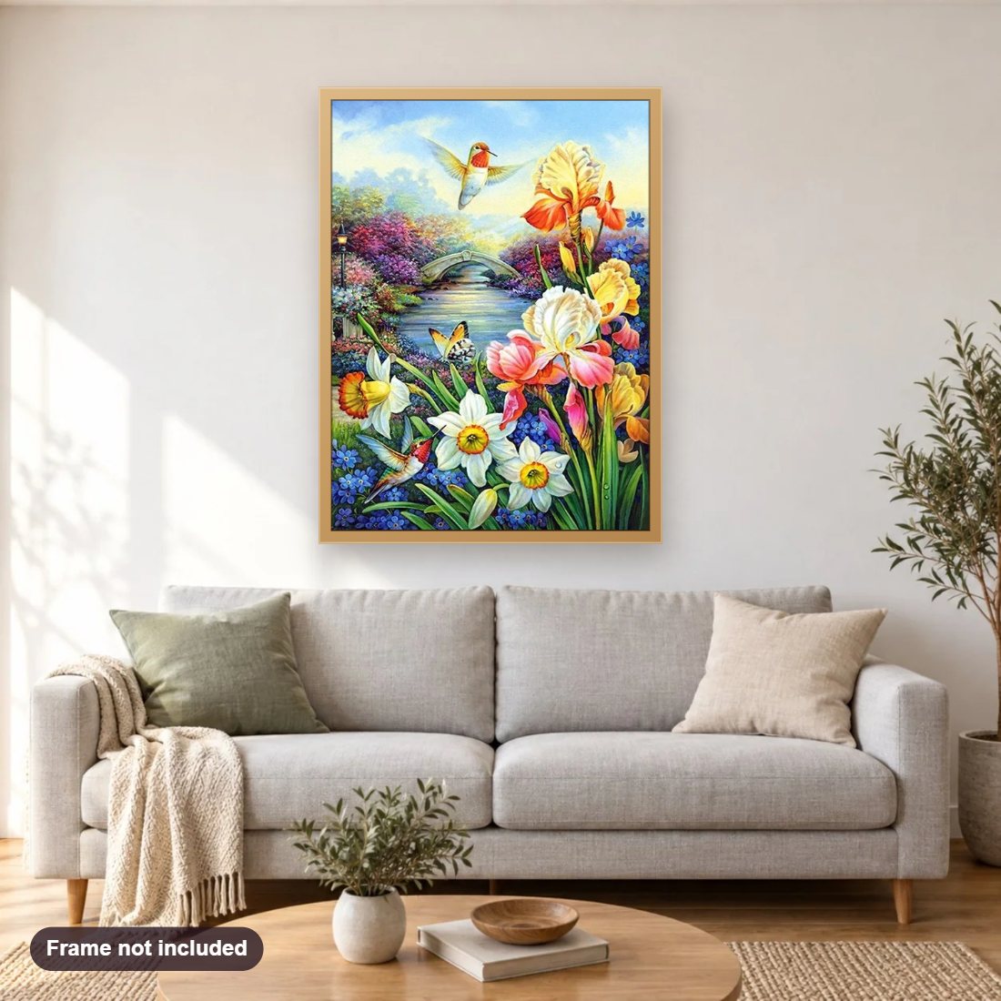 Pair of Humming Birds & Flowers diamond painting shown framed on a living room wall above a sofa
