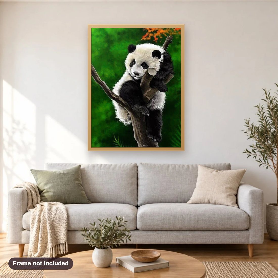 Panda Sleeping On Tree diamond painting shown framed on a living room wall above a sofa