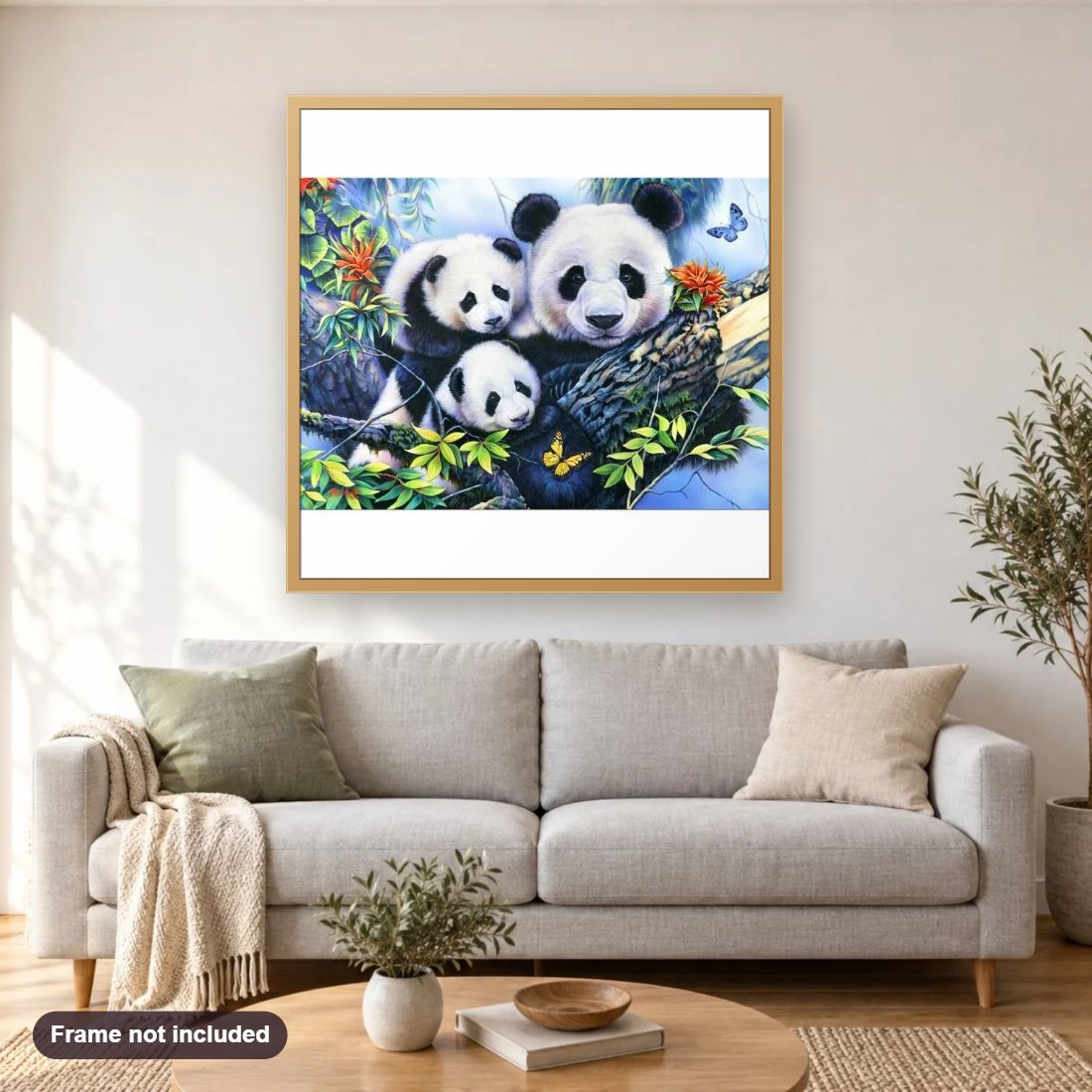 Panda With His Cubs diamond painting shown framed on a living room wall above a sofa