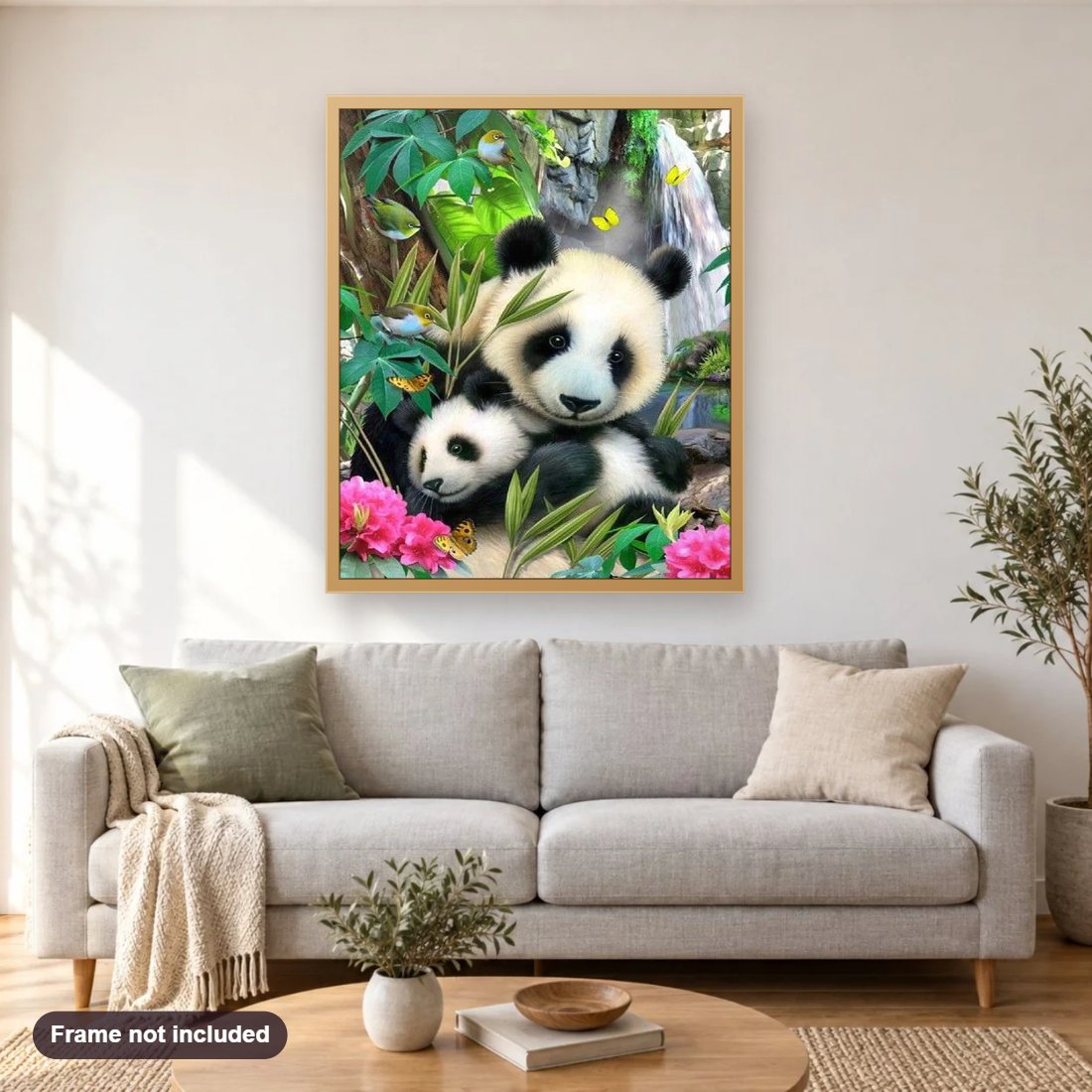 Pandas, Sparrows & Butterflies diamond painting shown framed on a living room wall above a sofa