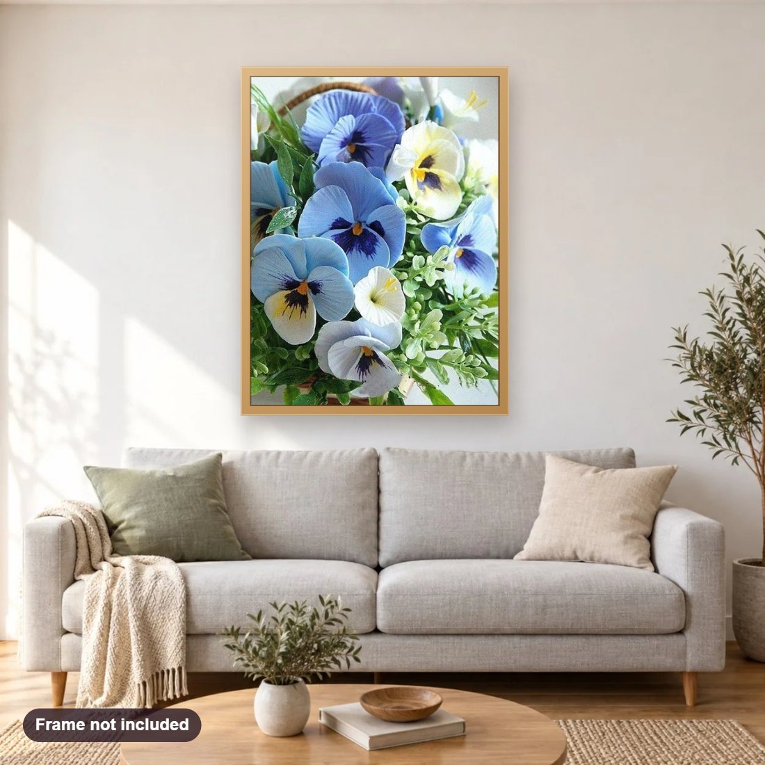 Pansy Flowers diamond painting shown framed on a living room wall above a sofa