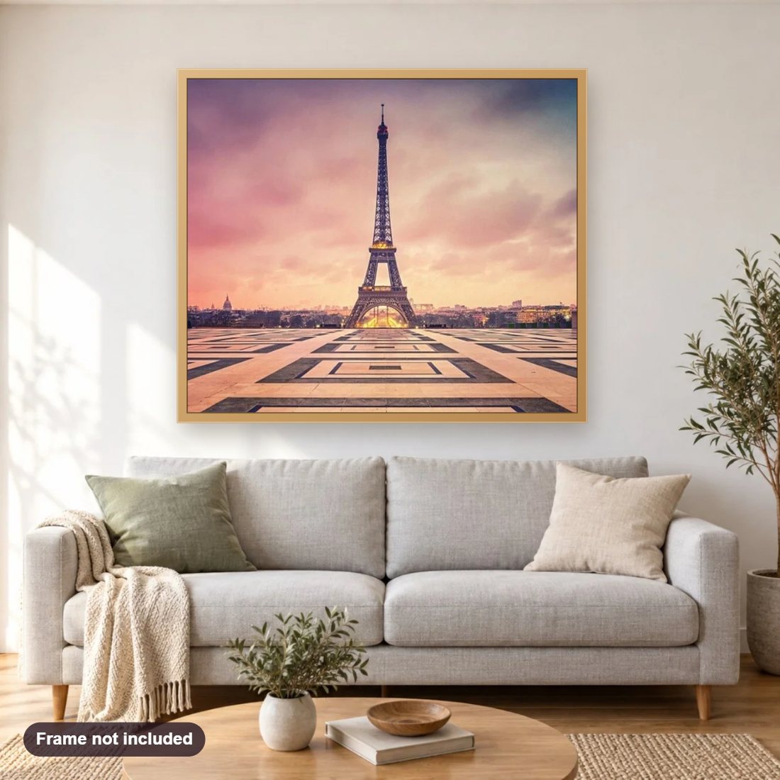 Paris Beauty diamond painting shown framed on a living room wall above a sofa
