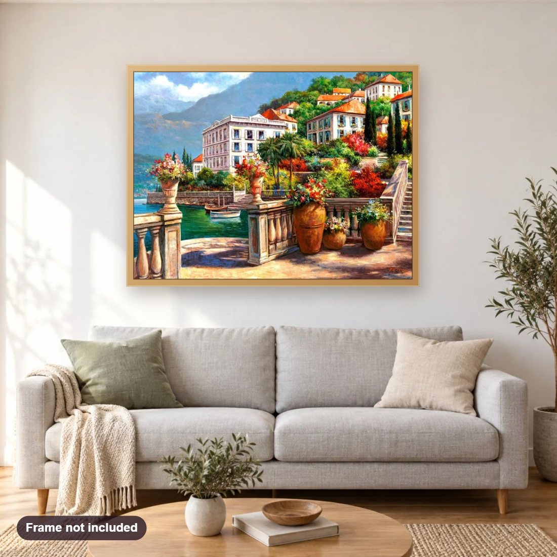 Peaceful Villas by the River diamond painting shown framed on a living room wall above a sofa