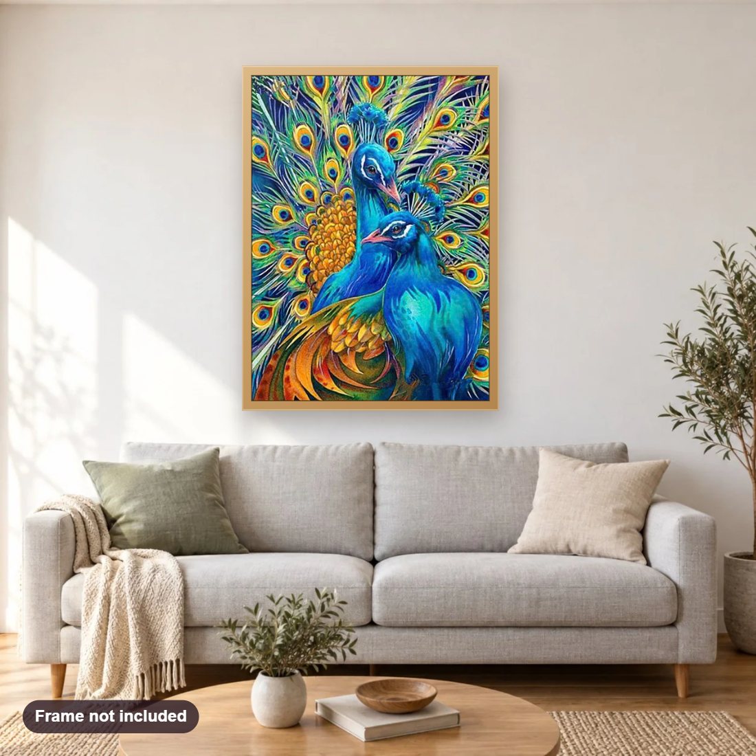 Peacocks diamond painting shown framed on a living room wall above a sofa