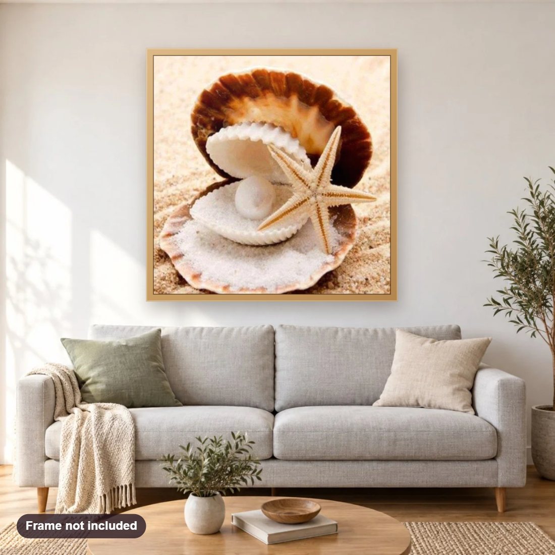 Pearl in the Oyster diamond painting shown framed on a living room wall above a sofa